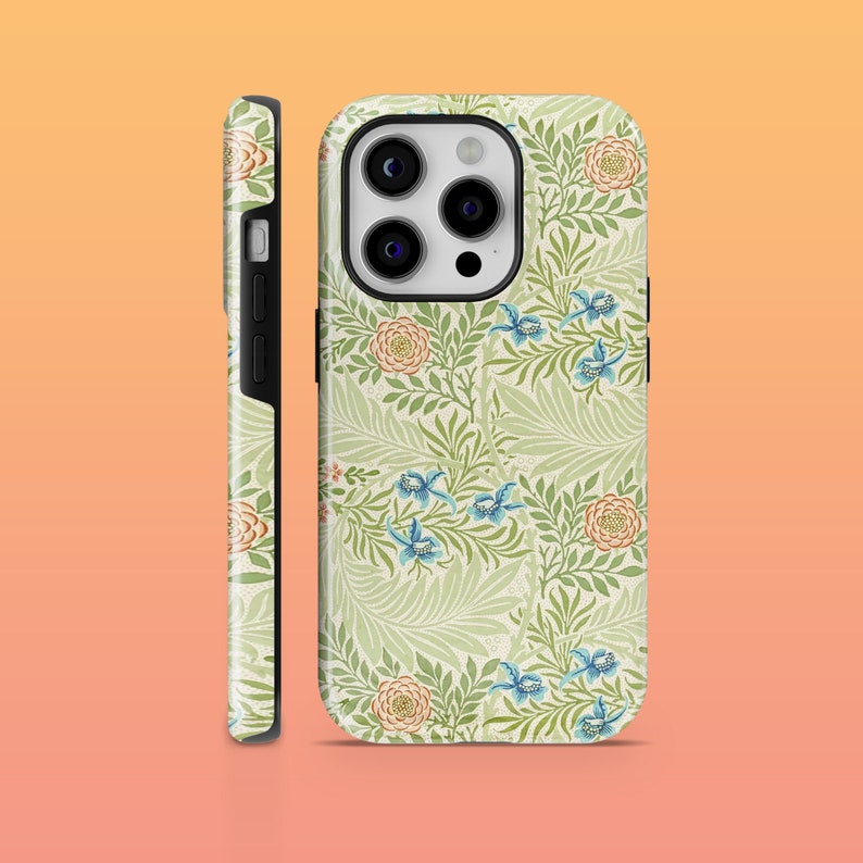 May include: A green, white, and blue floral phone case with a black camera bump. The case features a repeating pattern of leaves, flowers, and birds.