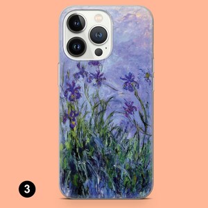 May include: A clear phone case with a painting of purple irises on a blue background. The case has a white camera bump with three black camera lenses.