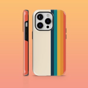 May include: A white phone case with a retro-style rainbow stripe design. The case has a raised camera bump with three lenses.