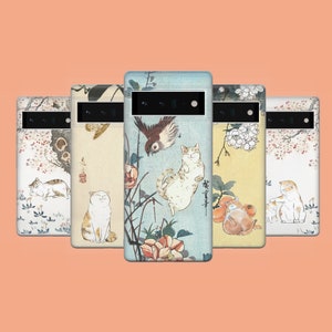 May include: Five phone cases with Japanese-style illustrations. Each case displays a different design, including cats, birds, and floral patterns. The cases are rectangular with a camera aperture.