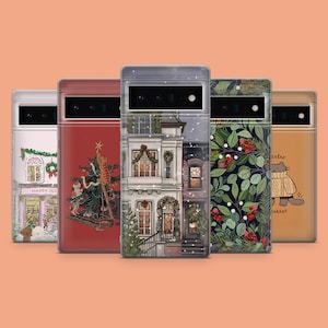 May include: Five phone cases with holiday-themed designs. The cases feature illustrations of decorated houses, Christmas trees, and a cat. One case has the text "Happy Holidays". The cases are in a row against an orange background.