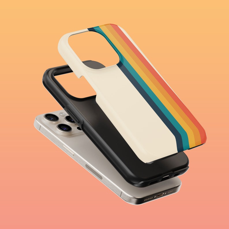 May include: A white phone case with a retro rainbow stripe design. The case is shown on top of a silver iPhone with a camera lens.