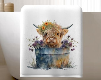 Serviette de bain vache Highland : décoration florale pour baignoire
