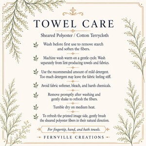 May include: A cream-colored card with the text "TOWEL CARE" in a decorative font. The card provides care instructions for towels, including washing and drying tips. The card is framed with floral elements and the brand name "FERNVILLE CREATIONS".