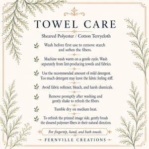 May include: A cream-colored informational card titled TOWEL CARE with dark blue text detailing instructions for sheared polyester and cotton terrycloth. The border features delicate green fern illustrations and thin brown lines, ending with FERNVILLE CREATIONS.