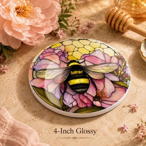 A 4-inch glossy ceramic coaster featuring a bumblebee on pink flowers, shown on a marble countertop with text reading 4-Inch Glossy.