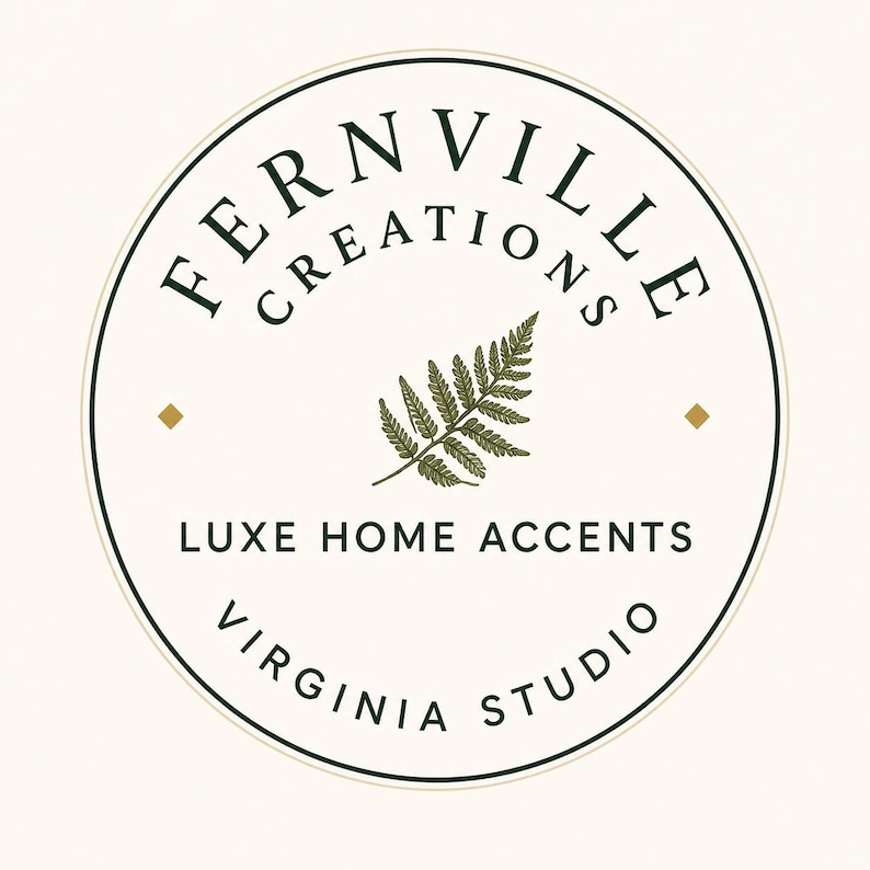 A circular logo with a green fern leaf in the center, surrounded by "FERNVILLE CREATIONS" and "LUXE HOME ACCENTS VIRGINIA STUDIO" on a light background.