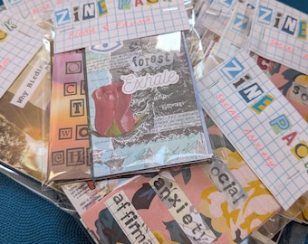 May include: A collection of zine packs in clear plastic sleeves. Each pack features a grid-patterned header labeled ZINE PACK with handwritten themes like Flora & Fauna or Social Anxiety. The covers display collage art with text like forest exhale and affirmations.