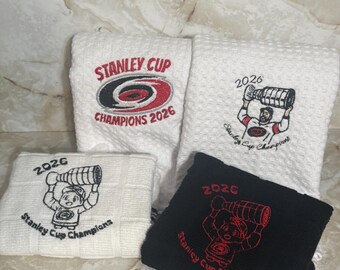 Machine embroidered, single dishtowel, patterns vary, hockey themed