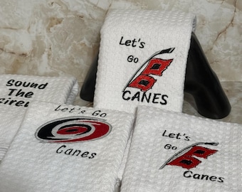 Machine embroidered, single microfiber dishtowel, patterns vary, hockey themed