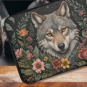 May include: A gray wolf with a floral design around its head. The wolf is looking directly at the viewer with a soft expression. The flowers are in shades of pink, red, yellow, and green.