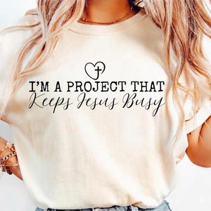 I'm A Project That Keeps Jesus Busy, Funny Christian Svg Png, Simple Trendy Christian Shirt Design Popular Modern Religious Coquette Quote