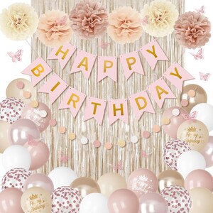 May include: A pink and gold birthday party decoration set. Includes a banner that reads "Happy Birthday", balloons, paper flowers, and butterfly accents. The balloons are in various shades of pink, white, and gold.