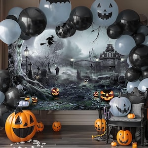 May include: A Halloween-themed party scene with black, gray, and orange balloons, a backdrop of a haunted house, and jack-o'-lanterns. The scene includes a witch flying across a full moon, creating a spooky atmosphere.