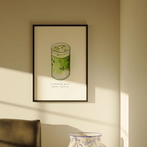 May include: A framed watercolour illustration of a glass of iced matcha with the text "Is somebody gonna matcha my fresh" underneath.
