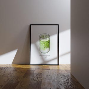 May include: A framed watercolour illustration of a glass of iced matcha with the text "If somebody gonna make my dream"