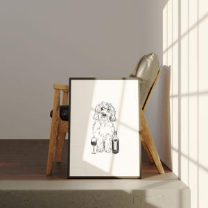 May include: A black and white line drawing of a dog holding a glass of wine and a bottle of wine. The drawing is framed and hanging on a wall.