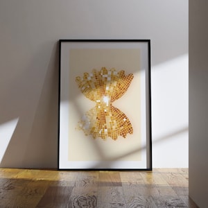 May include: A framed print of a gold bow tie made of small squares. The bow tie is on a light beige background.