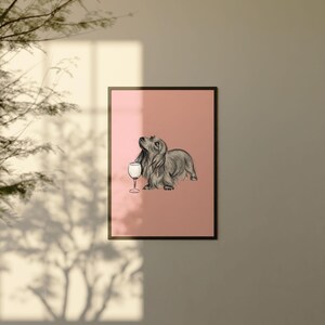 May include: A black and white illustration of a dachshund dog holding a glass of wine on a pink background.