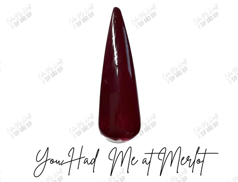 May include: A single, long, dark red nail polish bottle with the text "You Had Me at Merlot" written below it.