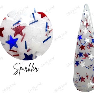 May include: Clear nail polish with red, white, and blue star and stripe glitter. The word "Sparkler" is written in cursive below a close-up of the glitter. The glitter is in a clear, pointed nail shape.