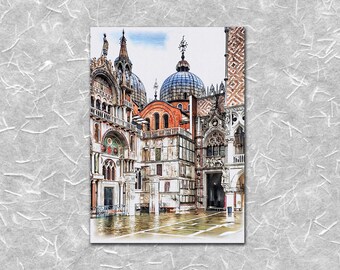 May include: Watercolor painting of St. Mark's Square in Venice, Italy. The artwork depicts the ornate architecture of the basilica and surrounding buildings, with domes and intricate details. The scene includes reflections in the water.