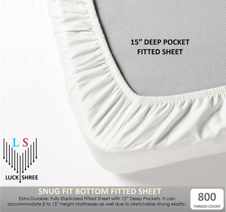 May include: White fitted sheet with a 15" deep pocket. The sheet is made of a durable, elasticized fabric and is designed to fit mattresses up to 15" high. The sheet has a thread count of 800. The text "SNUG FIT BOTTOM FITTED SHEET" is printed on the bottom of the image.