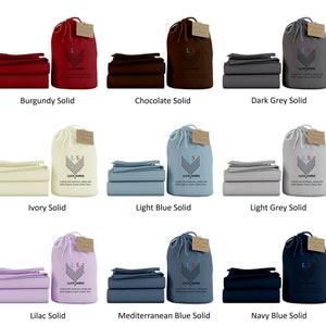 May include: Nine different colors of solid bed sheet sets, each set includes a flat sheet, fitted sheet, and pillowcases. The sets are arranged in three rows of three, with the colors burgundy, chocolate, dark grey, ivory, light blue, light grey, lilac, mediterranean blue, and navy blue.