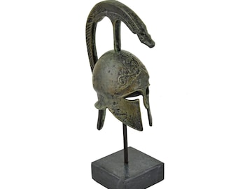 Spartan Warrior Helmet with Snake Design on a Marble Base – Corinthian Bronze Battle Helmet with Serpent Detail, Ancient Greek Warfare