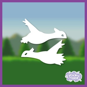 May include: Two white silhouette birds flying in a green and blue blurred background. The birds are facing the same direction and the top bird is slightly in front of the bottom bird.