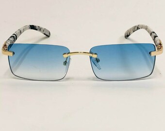 white buffs cartier glasses