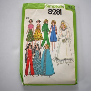 May include: A vintage Simplicity 8281 sewing pattern packet. The packet features illustrations of various doll outfits, including dresses, jumpsuits, and a bridal gown. The packet is green and white with the Simplicity logo and pattern number.