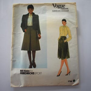 May include: Vintage Vogue Patterns sewing pattern featuring a skirt suit design. The pattern includes illustrations of the finished garments, with text that reads "Vogue Patterns American Designer" and "Bill Haire for Fredricks Sport".