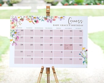 May include: A floral-themed calendar with a pink background and a white grid. The calendar is titled "Guess Baby Grace's Birthday" and has the months of May and June displayed. The date of June 29th is highlighted with a pink sticky note that says "Due Date".