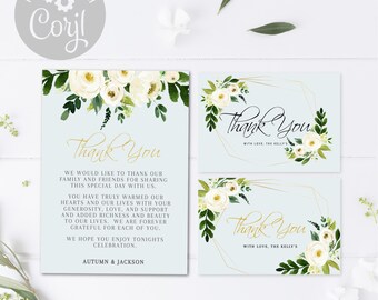 May include: Two thank you cards with a floral design and gold accents. The text on the cards reads "Thank You" with the names "Autumn & Jackson" and "The Kelly's".