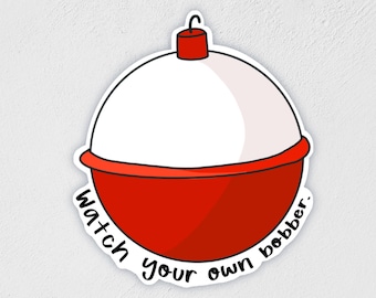 May include: A sticker featuring a red and white fishing bobber with the text "Watch your own bobber." The bobber has a rounded shape with a red base and top, and a white center. A small hook is at the top.