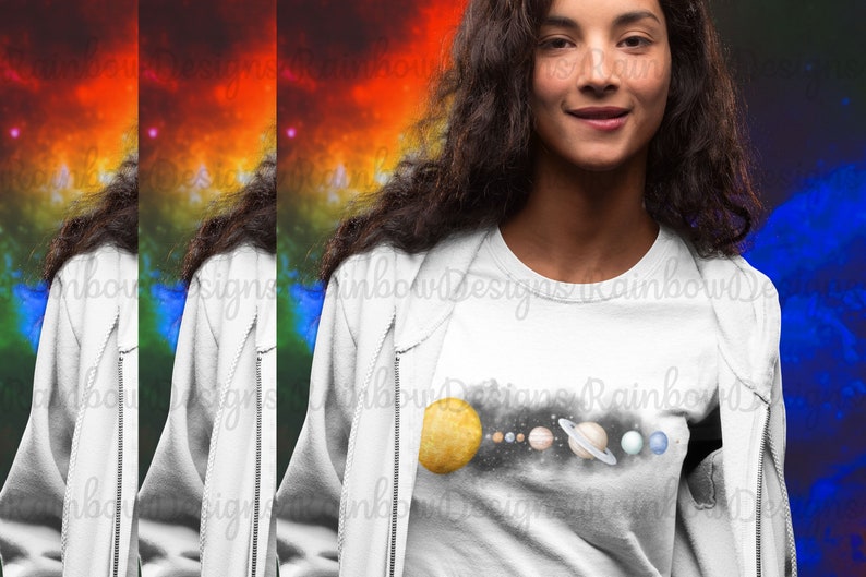 May include: A white t-shirt featuring a graphic of the solar system, with a yellow sun and planets in shades of blue, brown, and orange. The planets are arranged in a line, with the sun on the left and the planets extending to the right. The graphic is set against a black background.