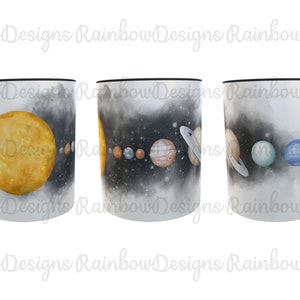 May include: A white ceramic mug with a black handle features a watercolour design of the solar system. The sun is yellow, the planets are various shades of orange, blue, and green, and the background is a dark grey with white stars.