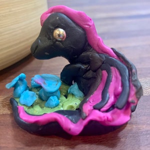 fantasy polymer clay dragon sculpture with mushrooms