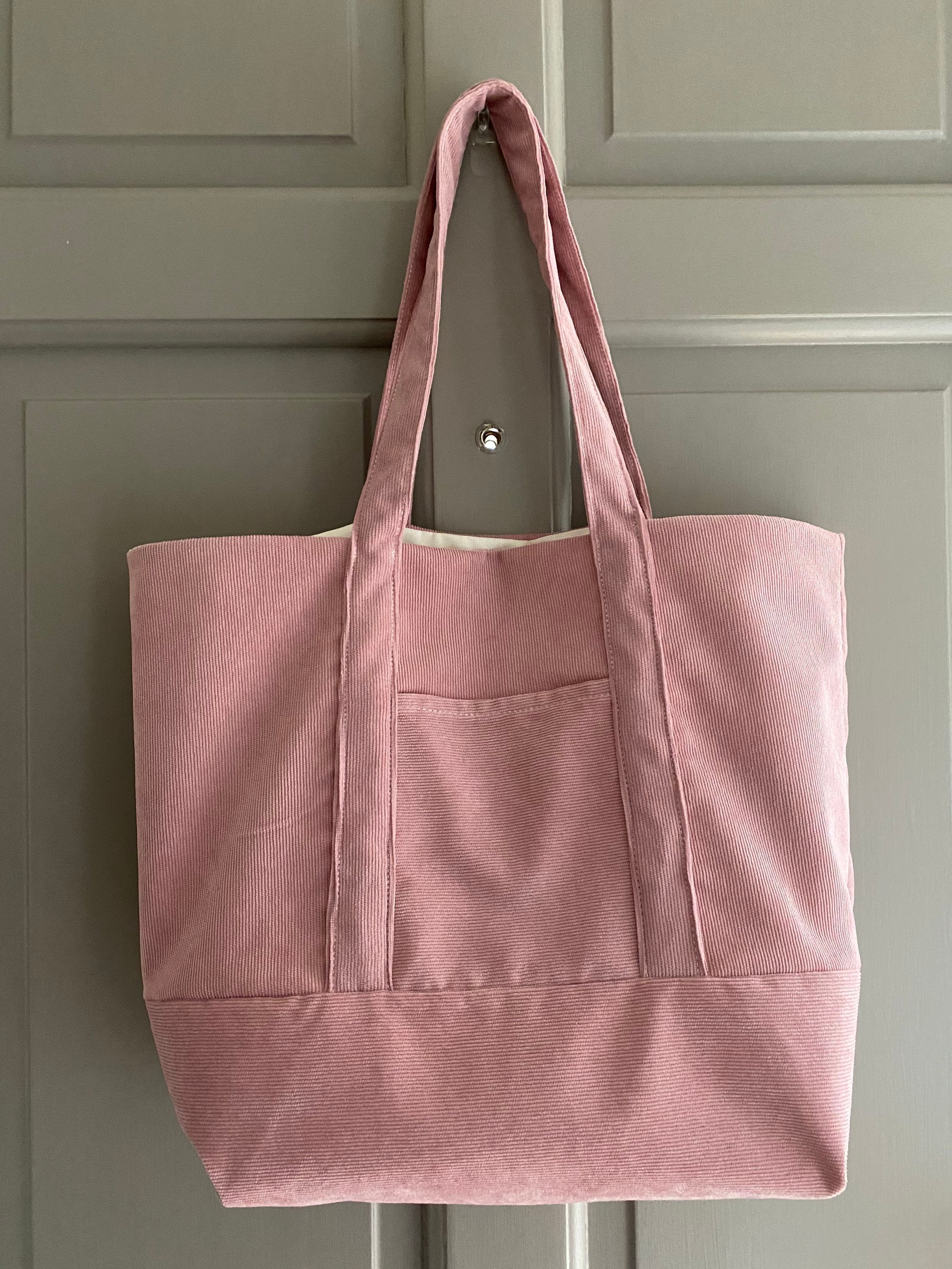 Pale pink tote bag on sale
