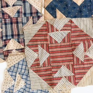 May include: A collection of four square fabric quilt blocks featuring various geometric patterns. The designs include red and blue plaid, cream with red dots, blue with white geometric prints, and red and green stripes with cream pinstripes.