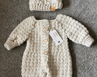 Gorgeous baby onsie, baby grow, pram suit, romper suit with hat.