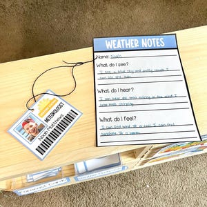 May include: A weather-themed educational set featuring a "Weather Notes" sheet and a "Meteorologist" ID tag. The ID tag displays a photo and the name "Noah Matthews." The notes sheet has prompts about observations and feelings related to weather.