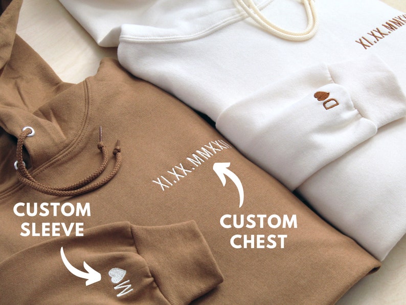 Custom date, English text, words, or phrase on chest shown. We will convert it to roman numerals if the date is provided as a standard date format. Personalized initial example with heart on sleeve shown for both hoodies pictured for matching couple.