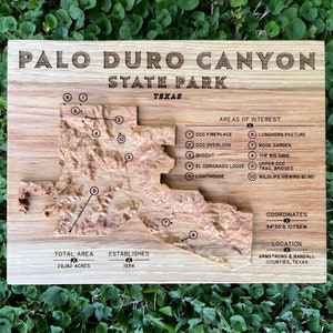 Palo Duro Canyon State Park topographic map, carved from a solid block of wood, with park details and notable features