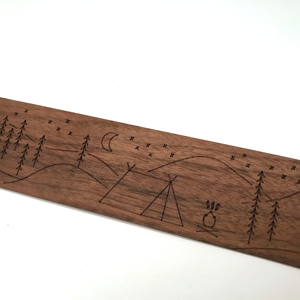 Wooden bookmark with laser-etched camping artwork; solid walnut with nature inspired camping in the woods art