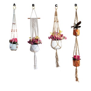 May include: Four macrame plant hangers with different styles and colors. The hangers are made of natural fibers and have a rustic look. They are perfect for adding a touch of bohemian style to your home.