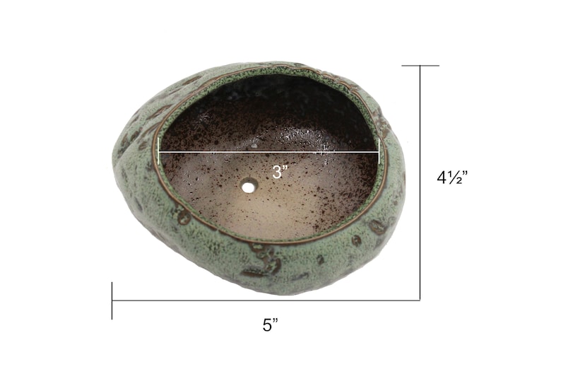 Glazed ceramic succulent pot in copper patina green color.  The unique uneven surface makes the pot look like a stone.  Perfect for succulents, cacti, or small house plants.  Drainage hole at the bottom.
