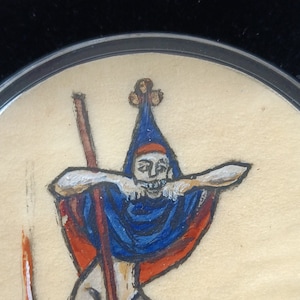 May include: A hand-painted illustration of a person wearing a blue and red hat with a gold crown. The person is holding a long, thin stick and has a white beard.