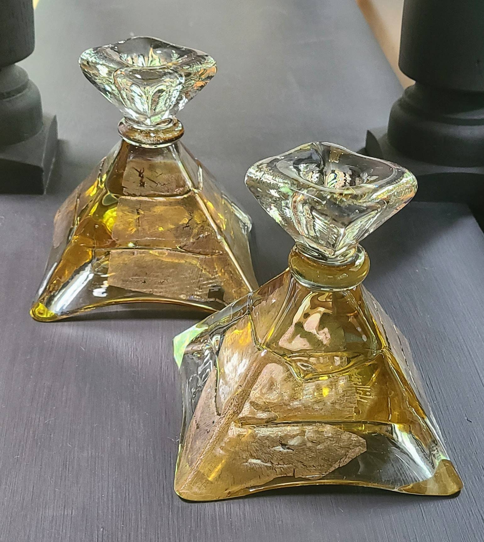 Gold pyramid shape candle stick holders. Pair of jeweled lighting by